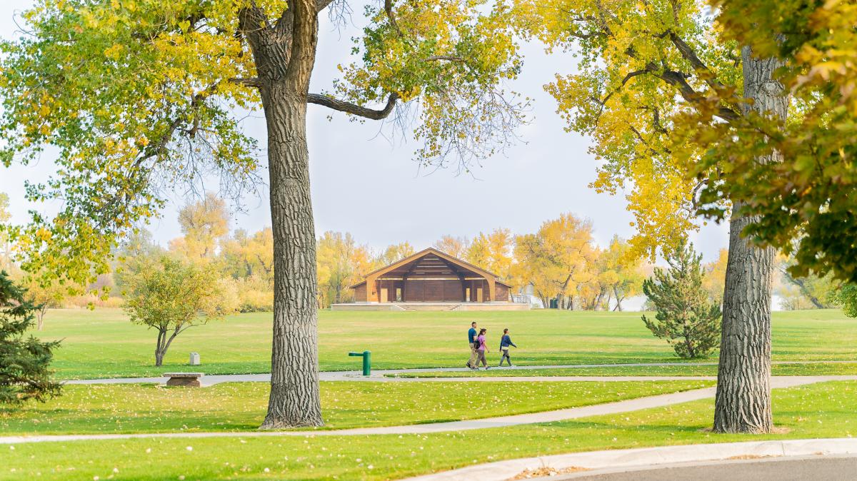 People walking in Lions Park, a popular spot for dog walkers in Cheyenne, Wyoming.
