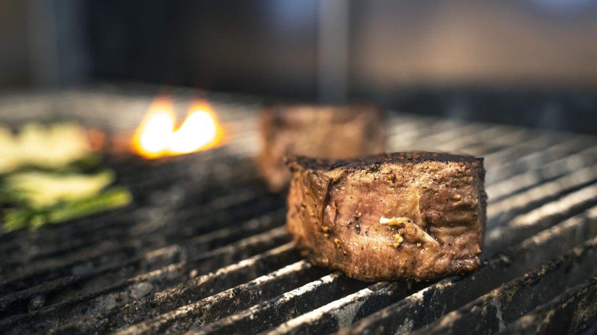 a filet mignon on the grill at the Metropolitan Downtown