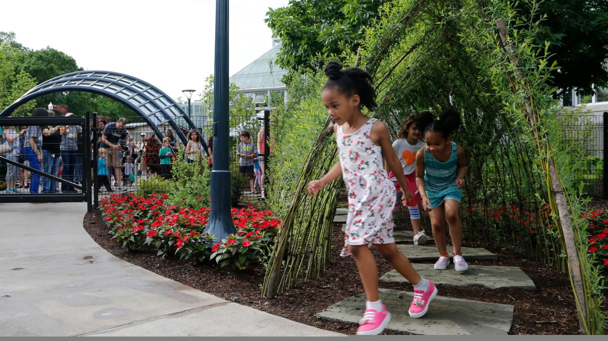 Kids play in the Children's Garden at the Franklin Park Conservatory & Botanical Gardens in Columbus.