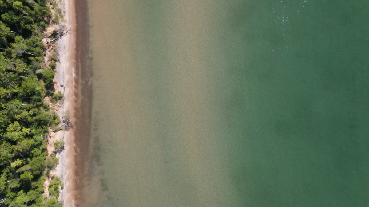 a top down aerial shot of the shallow waters of misery bay