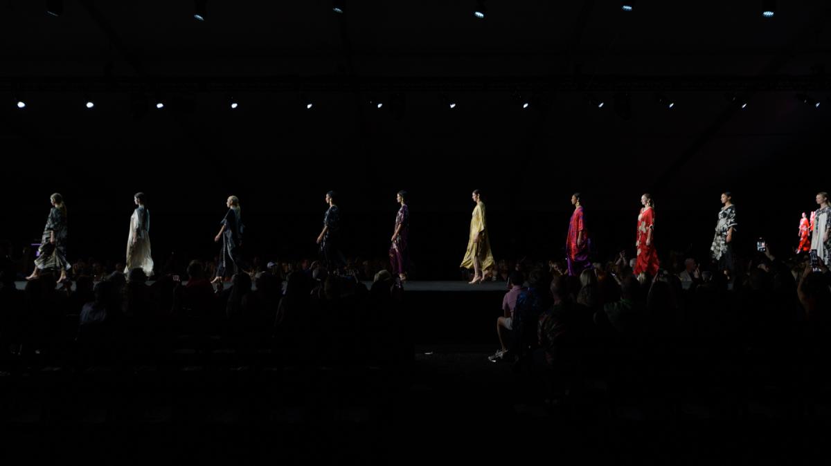 Ten models are walking down the runway in a line during Fashion Week El Paseo 2023.