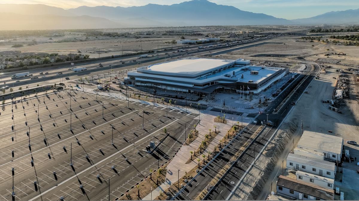 Exterior of Acrisure Arena and its parking lot.