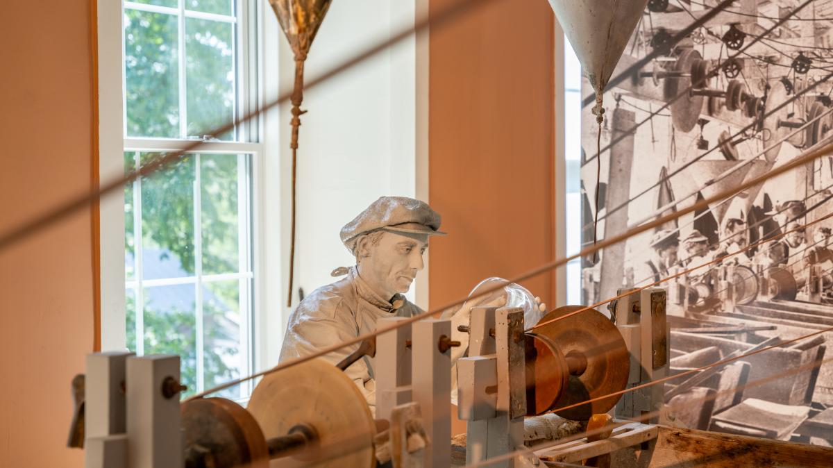 A display inside the Dorflinger Glass Museum illustrating the glassmaking process.