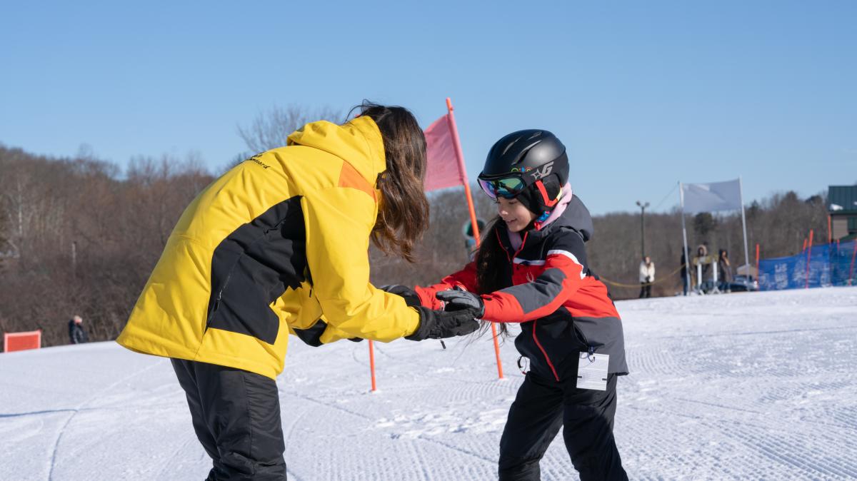 A child taking a ski lesson at Shawnee Mountain in the Poconos.