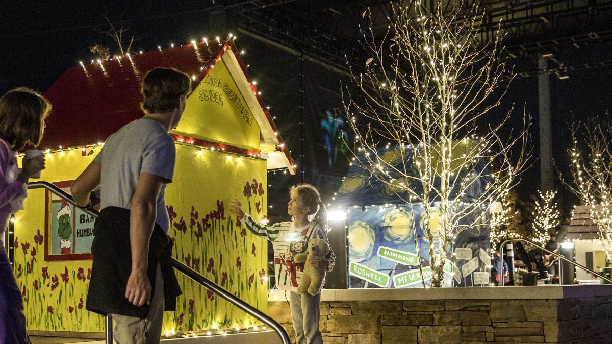 A young girl looking at the lights and decorations at the Sparkle Sandy Springs event at City Springs.