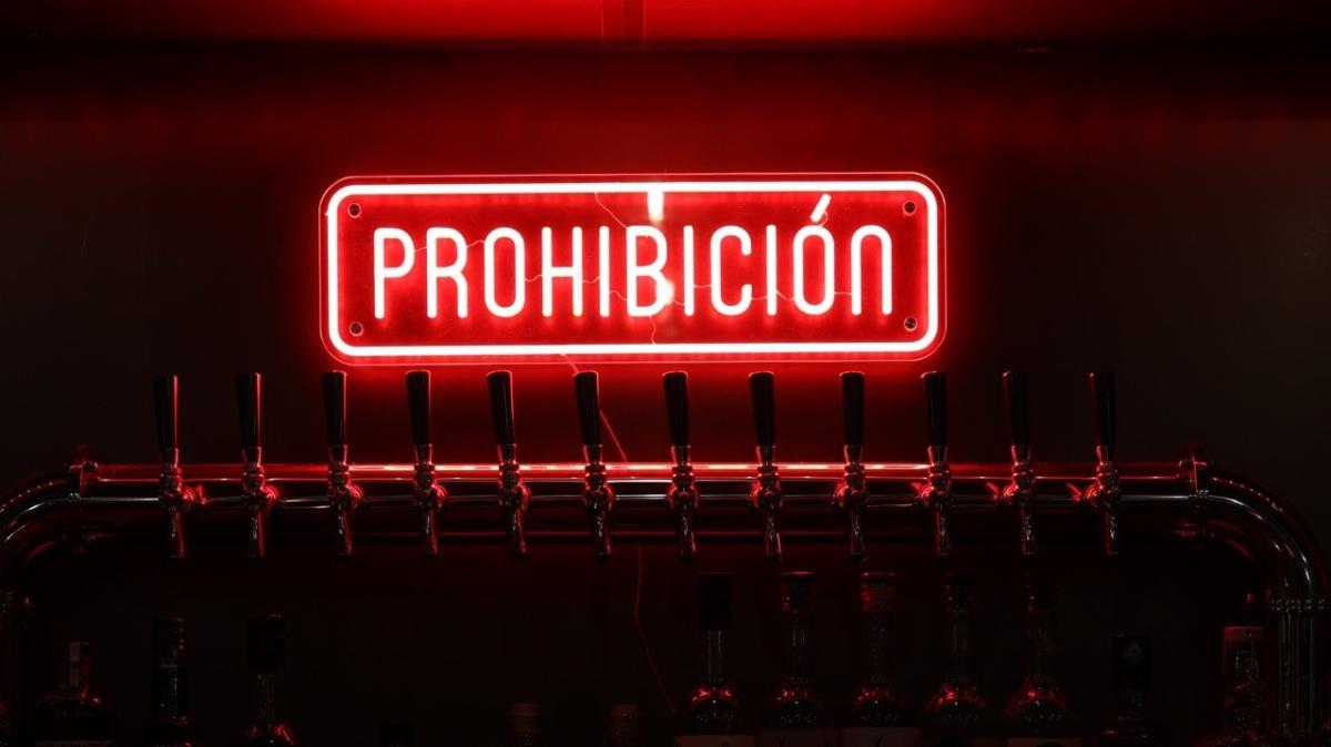 Red neon light at a bar