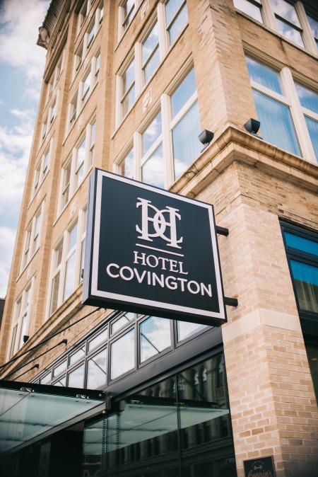 outdoor brick and windows with sign for Hotel Covington on Madison Avenue in covington ky