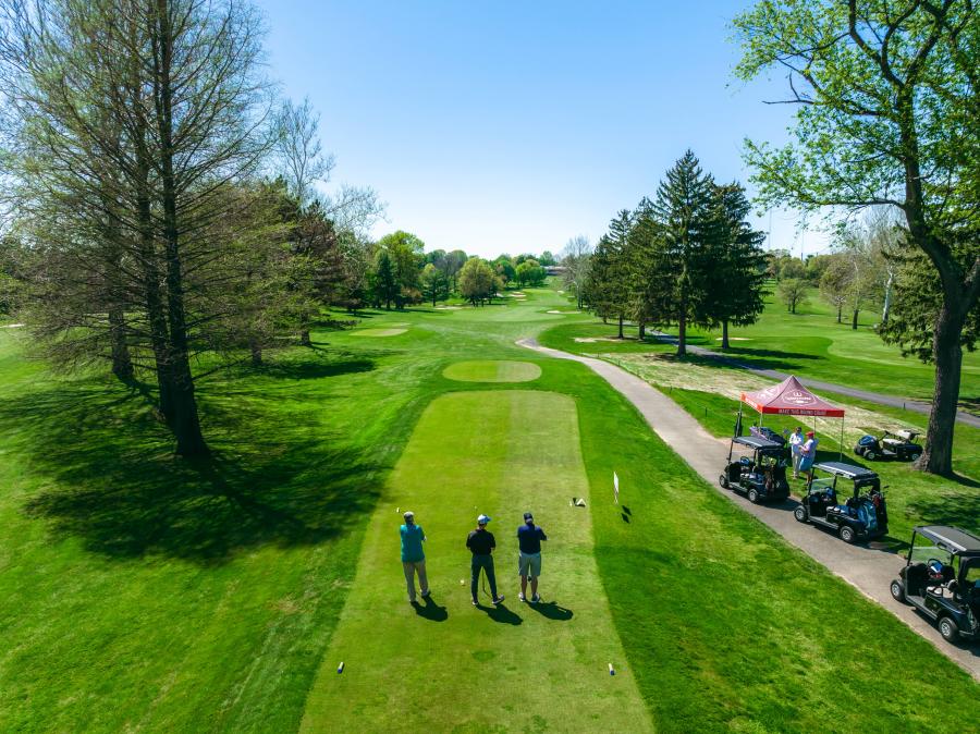 Golfers look out at the course