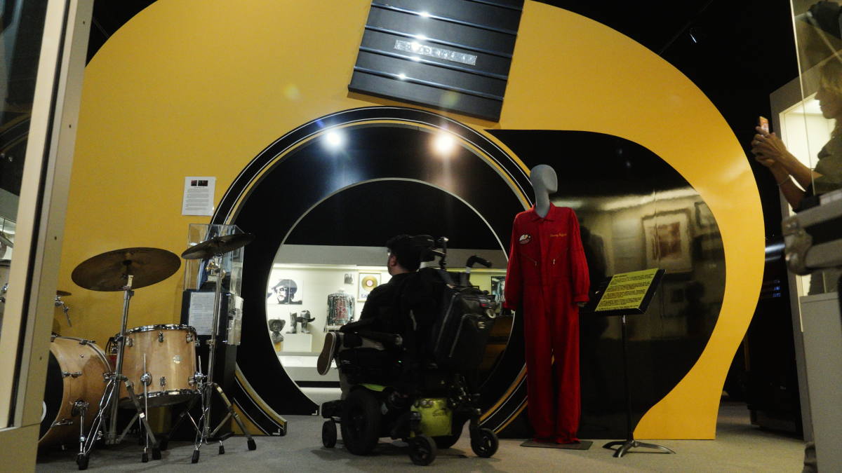 Cory Lee enters the giant yellow guitar pathway at the Alabama Music Hall of Fame