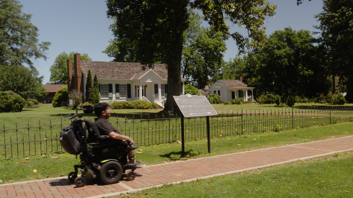 Cory Lee in front of the home of Helen Keller, Ivy Green.