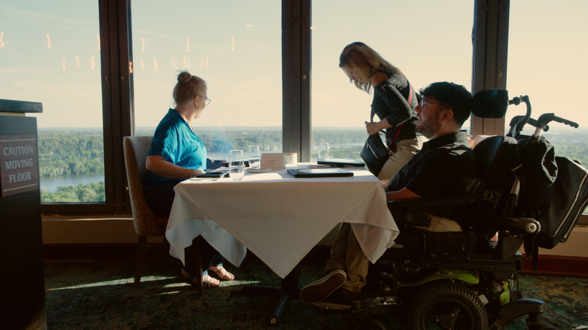 Three guest enjoying the view at 360 Grille atop the Renaissance Tower.