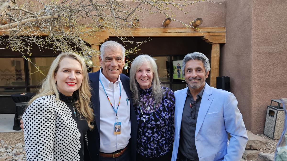 A picture of Mike Canfield with Tania Armenta and two past Visit ABQ Board chairs.