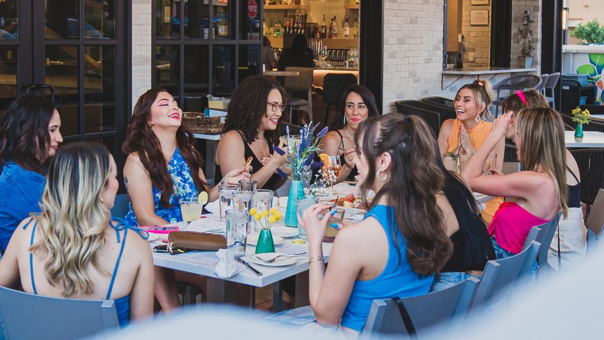 A group of young women dine at Tula's Kitchen.