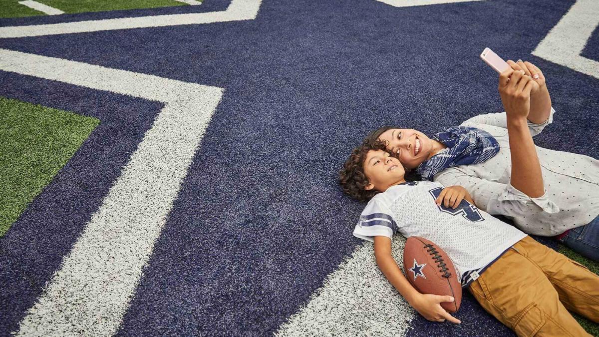 Mom and Son on AT&T Stadium Field 