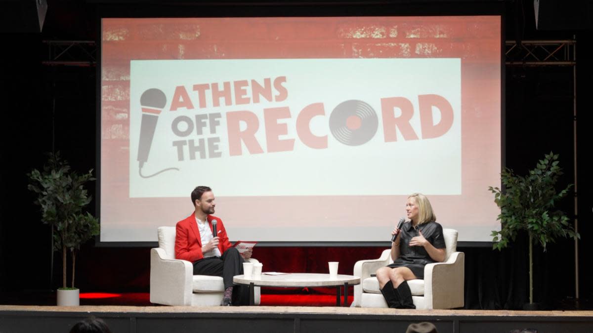 Cameron Jay Harrleson and Katie Williams record a podcast episode at the Visit Athens annual meeting in Oct of 2025.