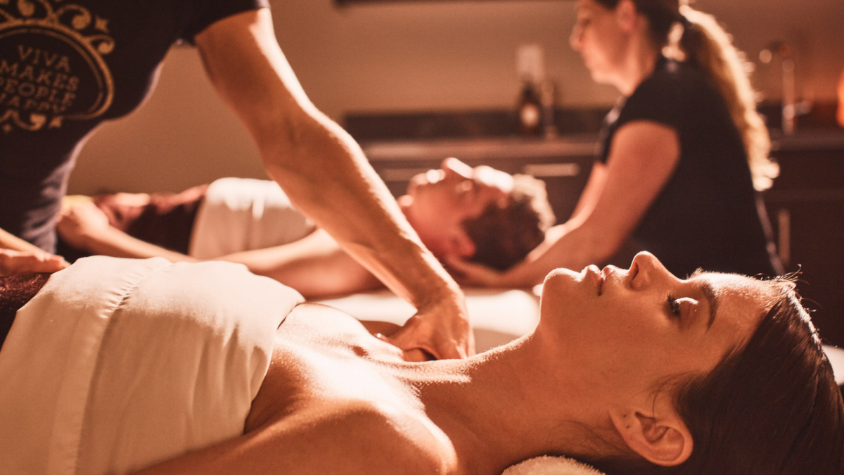 Image of a man and women both receiving massages at Viva Day Spa.