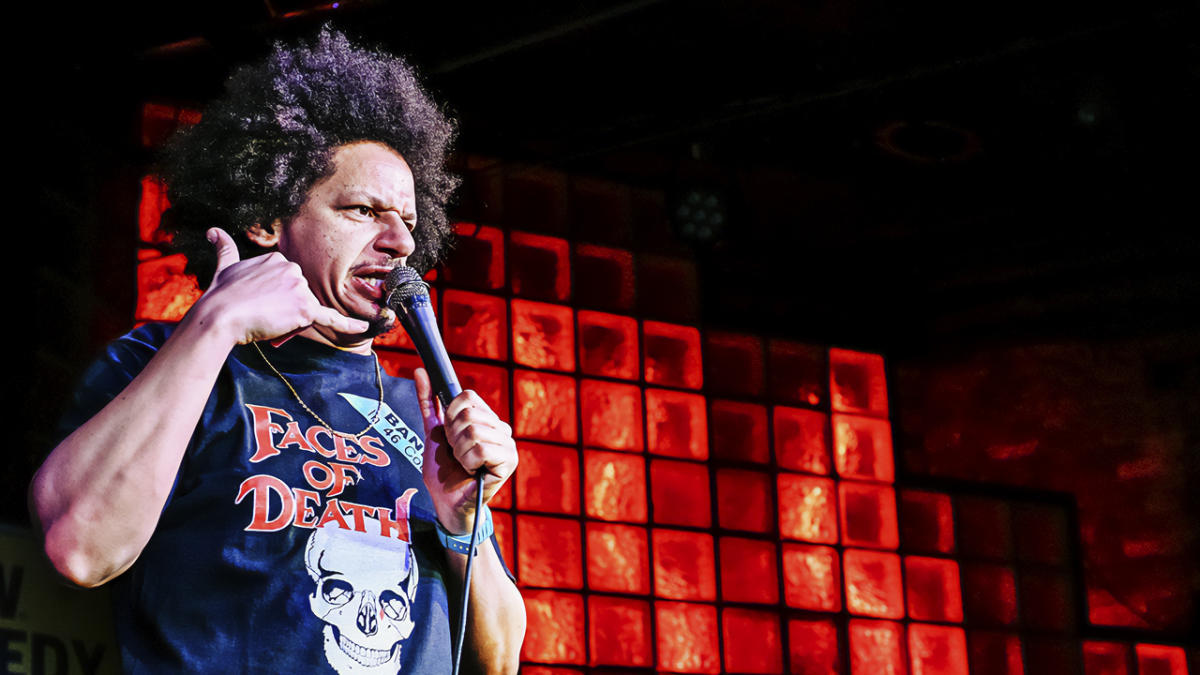 Eric Andre holding a mic and doing a comedy set at SXSW.