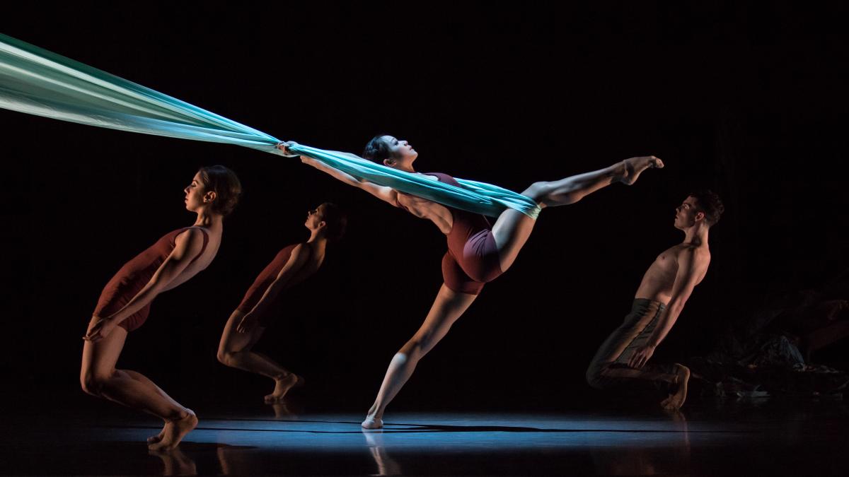Cincinnati theater with silk curtain dancer stretching leg