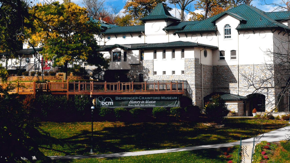 Image is of the Behringer-Crawford Museum on a bright sunny day during the fall.