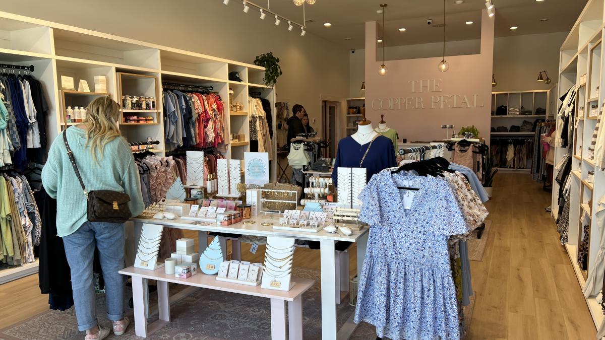 woman shops at a boutique