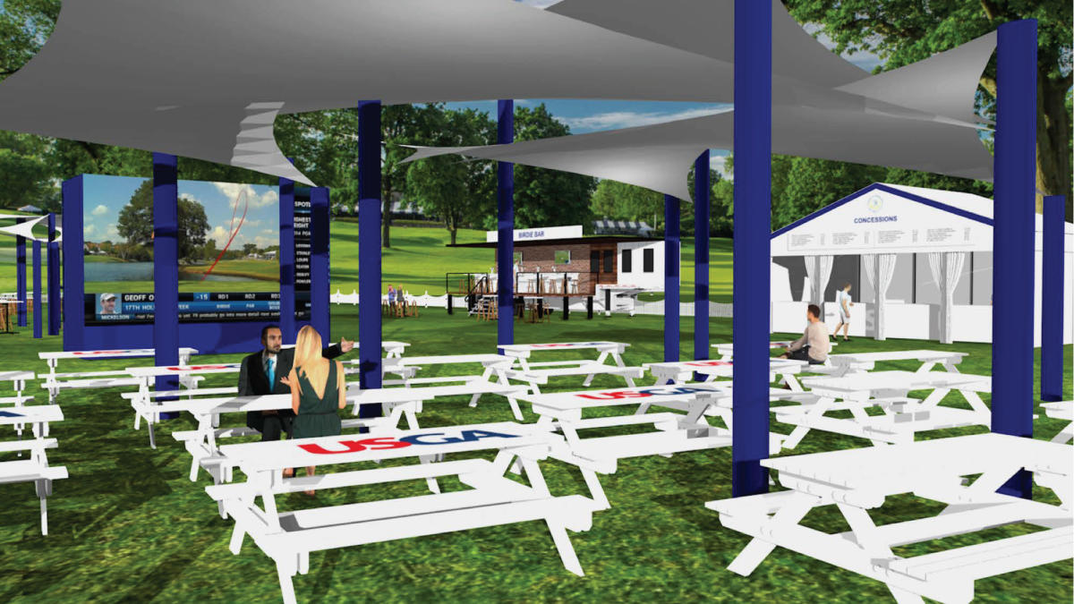 People sitting at tables under tents and golf simulators at the 19th Hole setting at the 2022 U.S. Senior Open