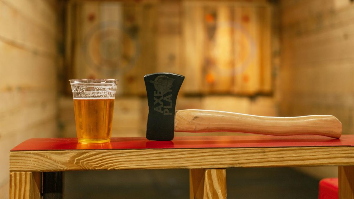 a beer and an axe at axe play