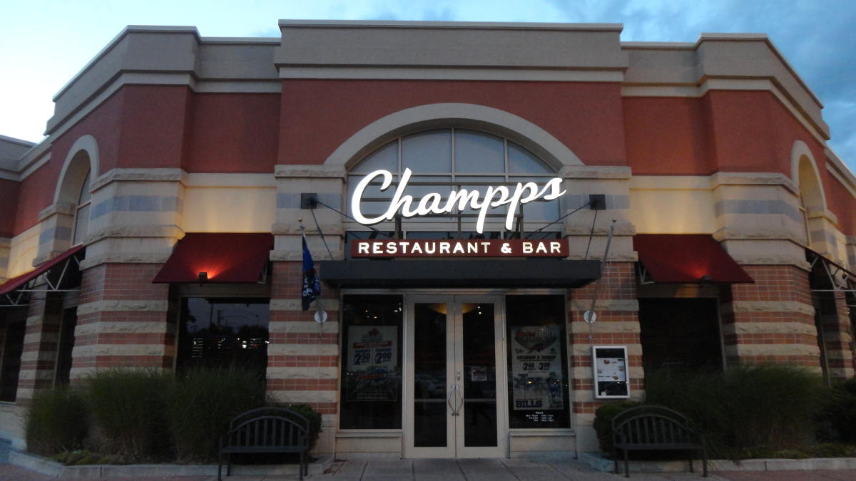 Front entrance of Champps Kitchen and Bar in Victor NY at dusk.