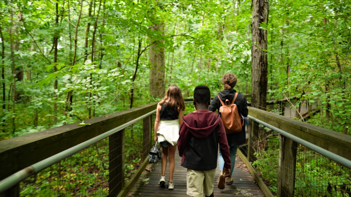 Family on trail through the Lindenwood Nature Preserve