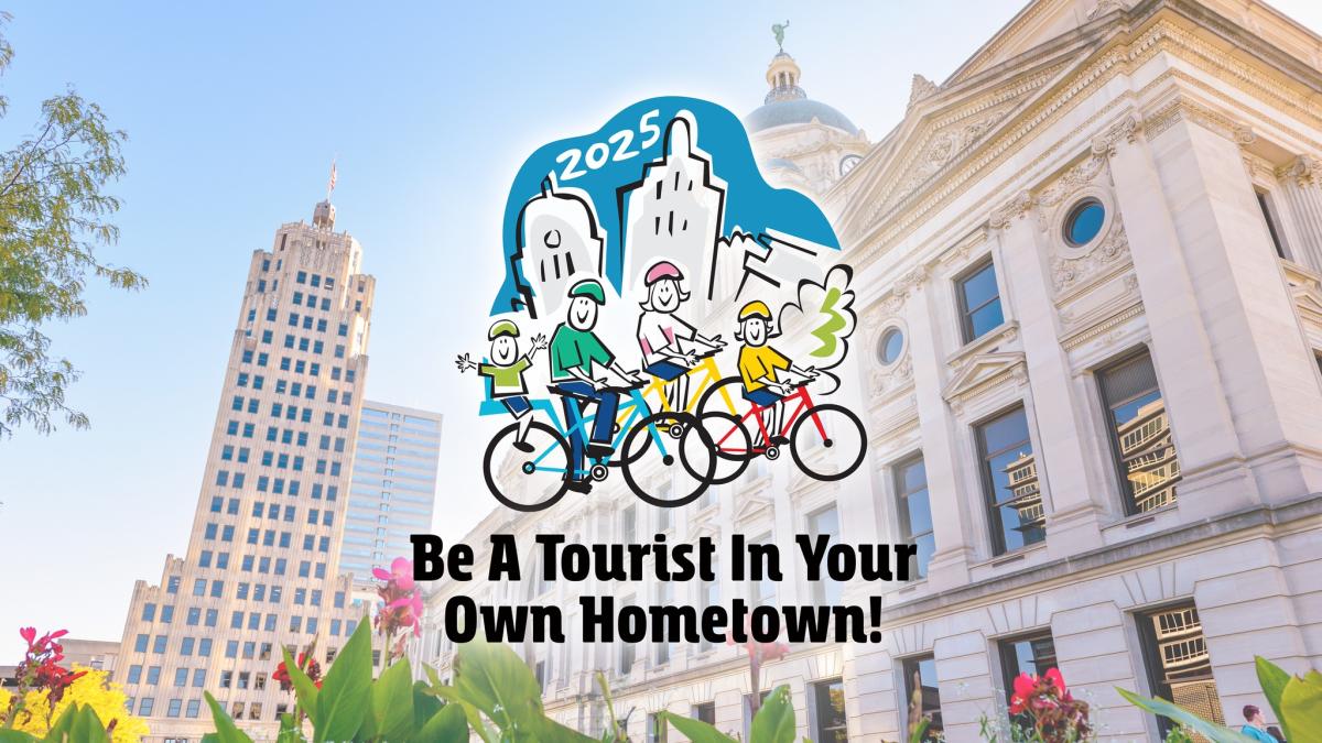 2025 Be A Tourist Logo superimposed over photo of Allen County Courthouse and Lincoln Tower.