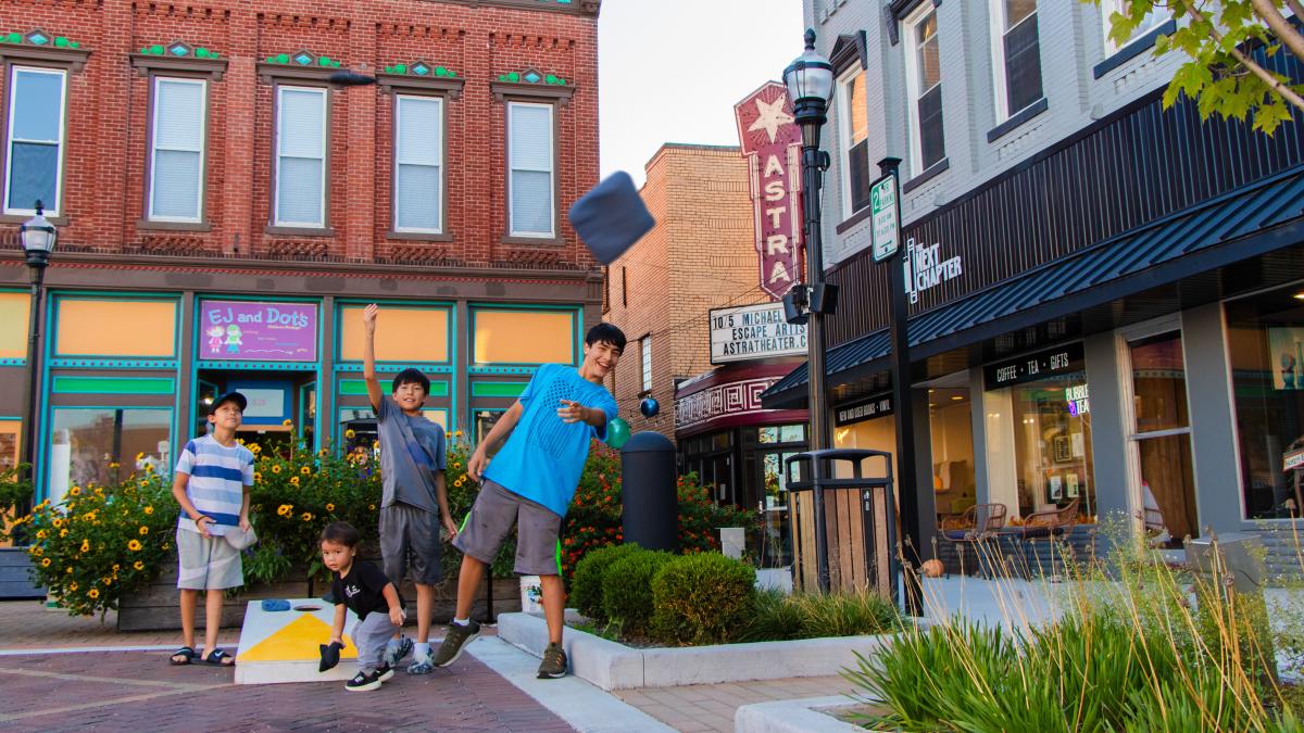 Family playing cornhole bags in Jasper