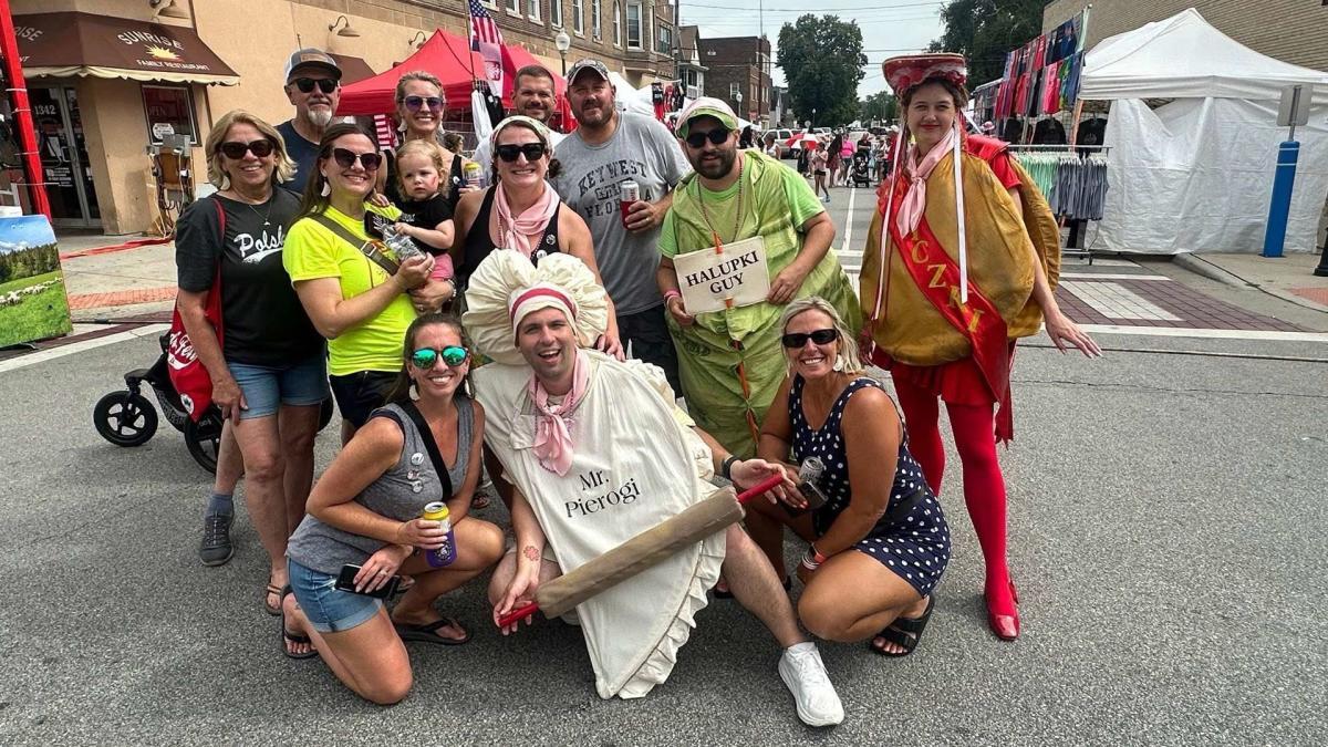 Mr. Pierogi in front of a group of people during Pierogi Fest
