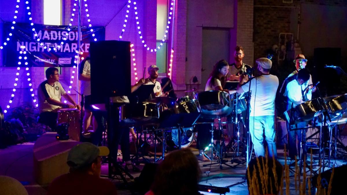 A band on stage at a Madison Night Market