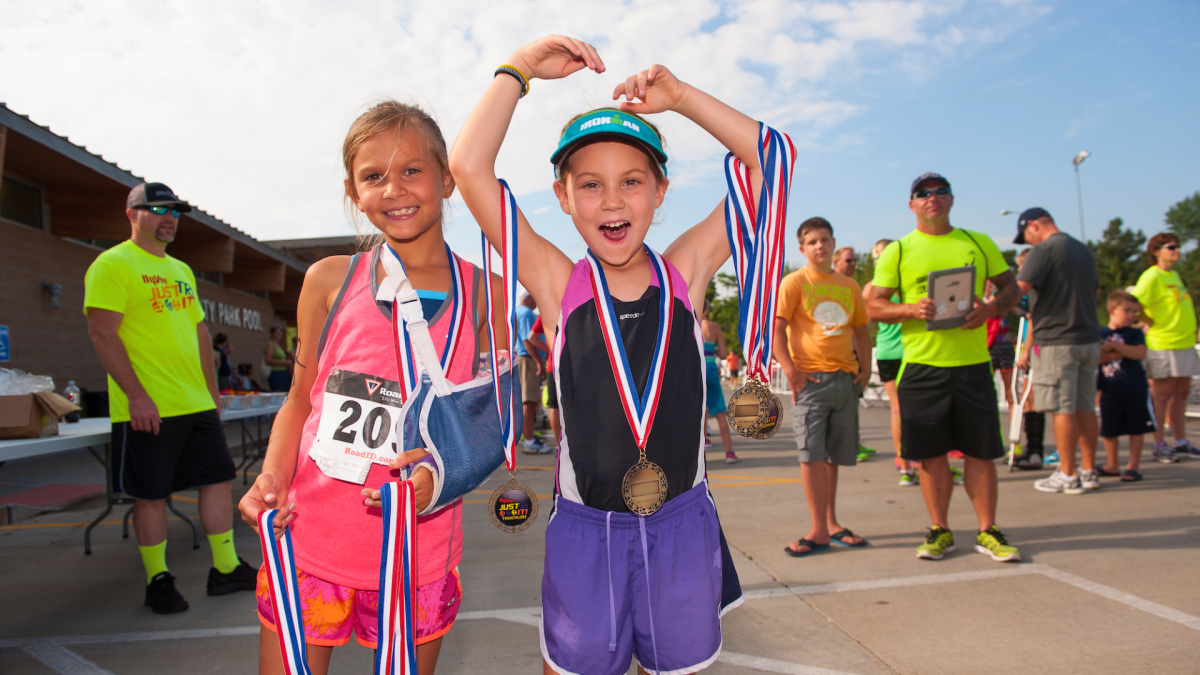 Kids with medals at Just Tri-It Triathlon
