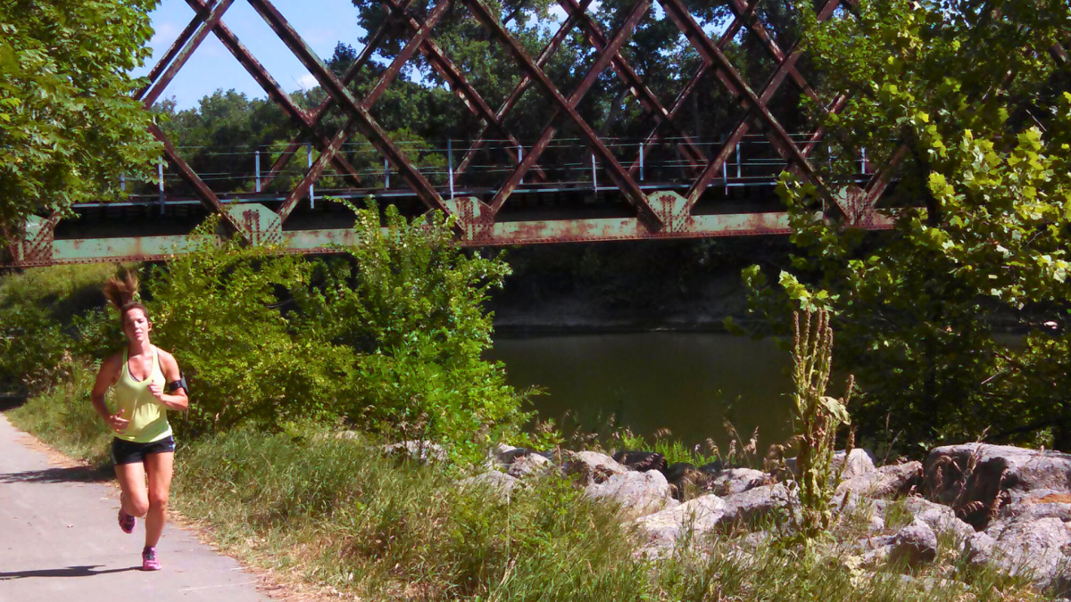 Runner on Linear Trail with bride in background