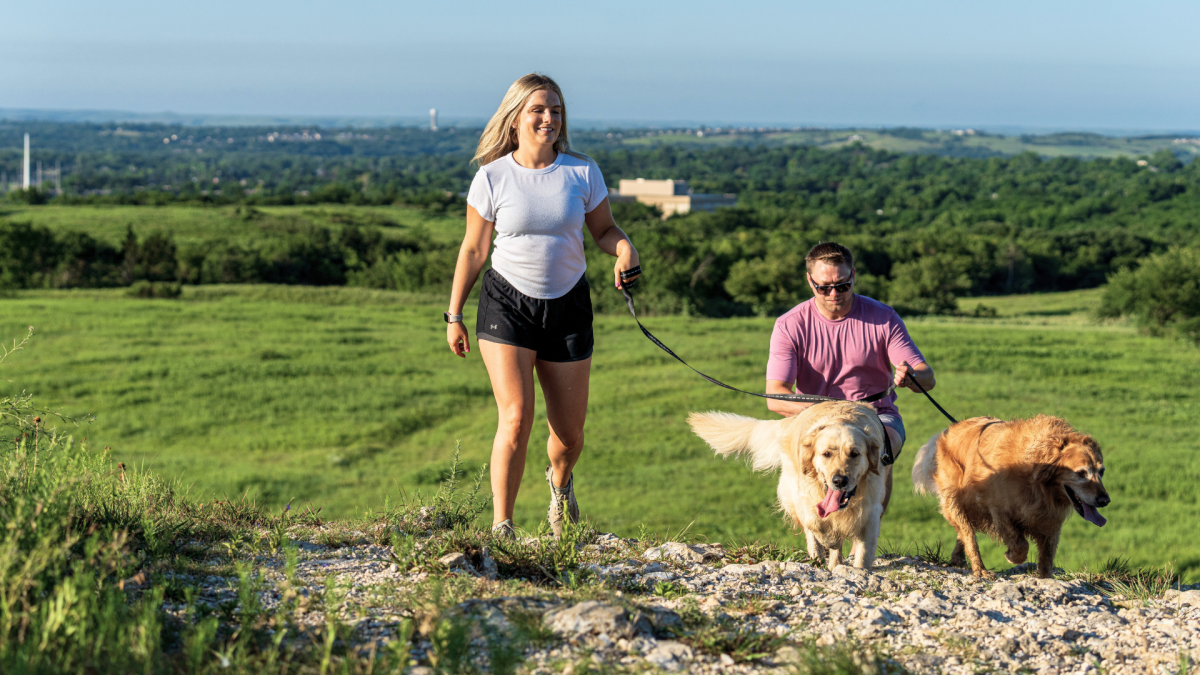 Couple and their two dogs at Washington Marlatt Park