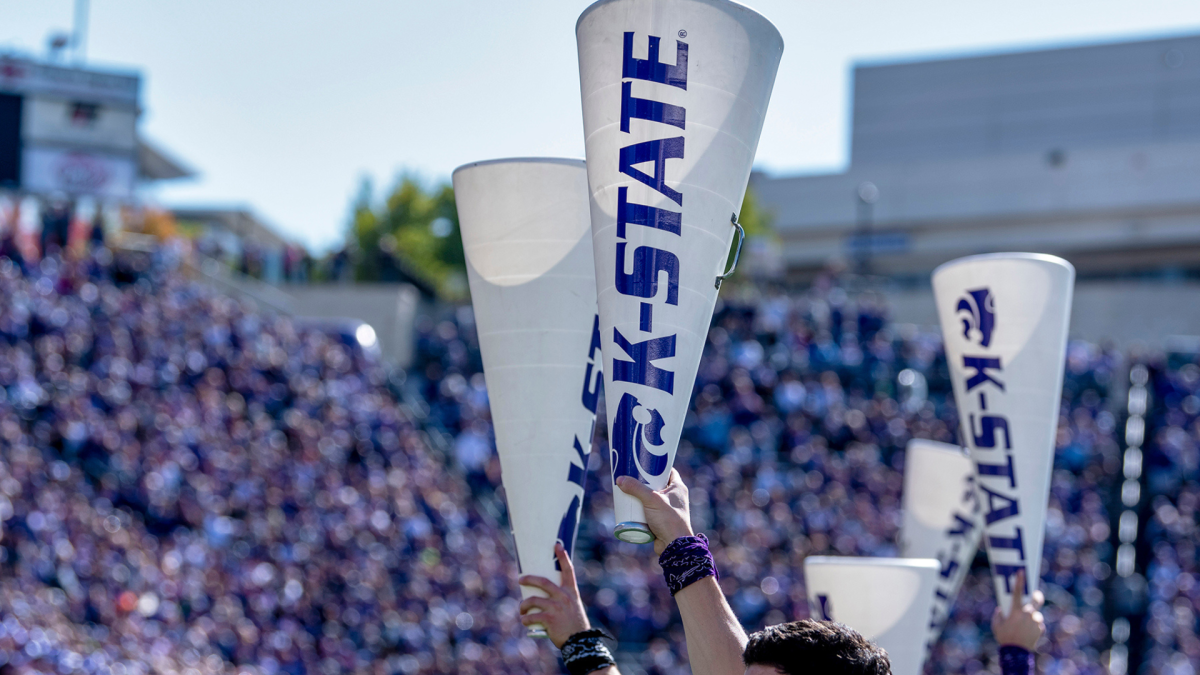 K-State megaphones being held up at a K-State game.
