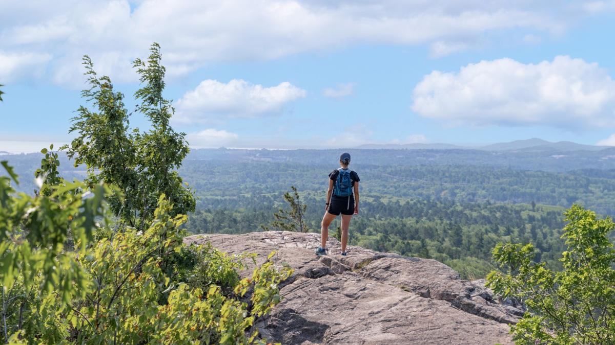 A hiker at Sugarloaf Mountain, Marquette, located in the Upper Peninsula of Michigan