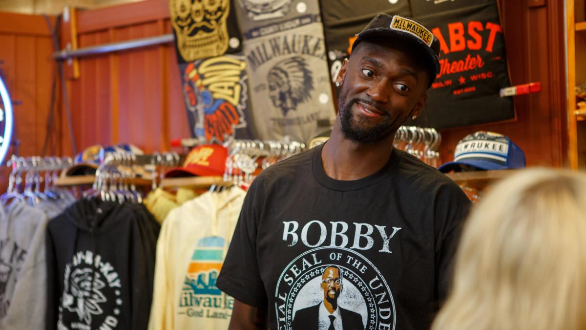 Bobby Portis in front of a wall of milwaukee merch