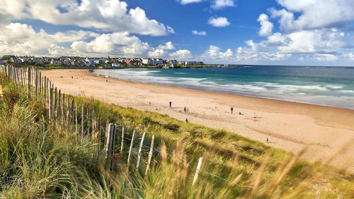 East Strand beach, Portrush with people out enjoying the beach