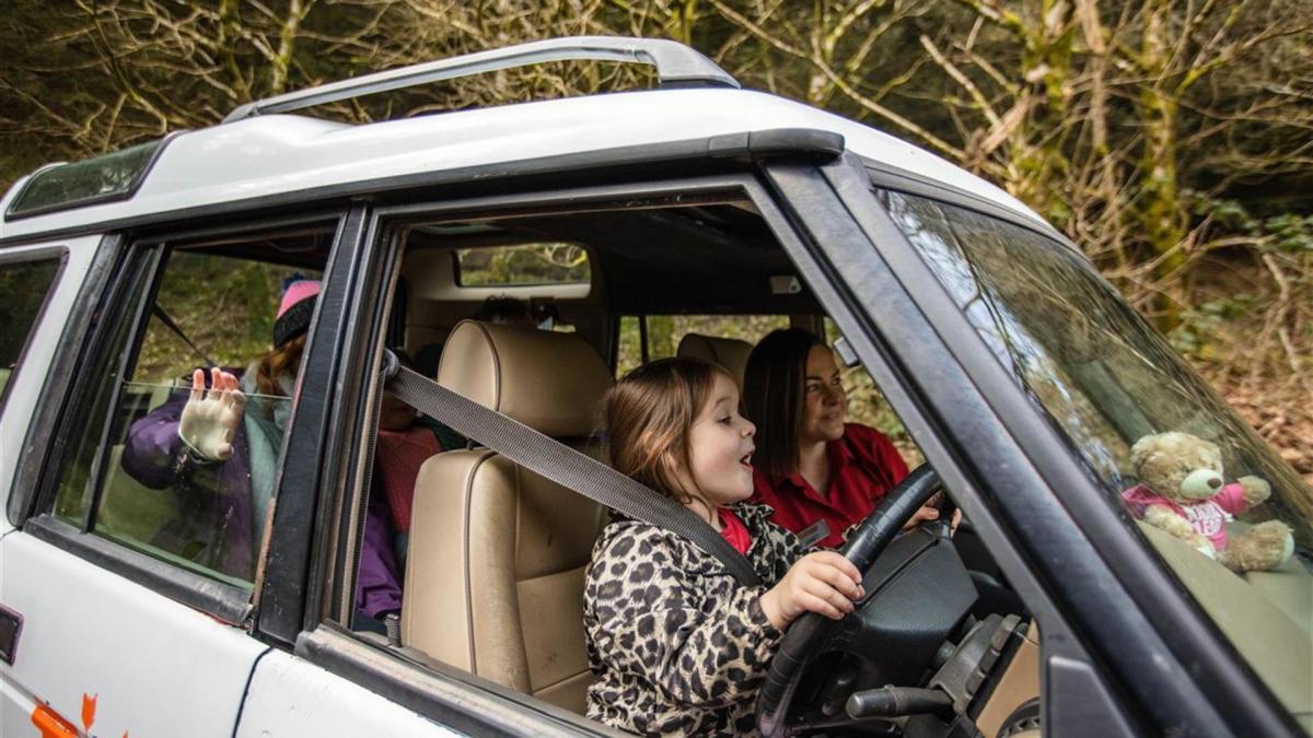 Visitors driving a car at Todds Leap Activity Centre
