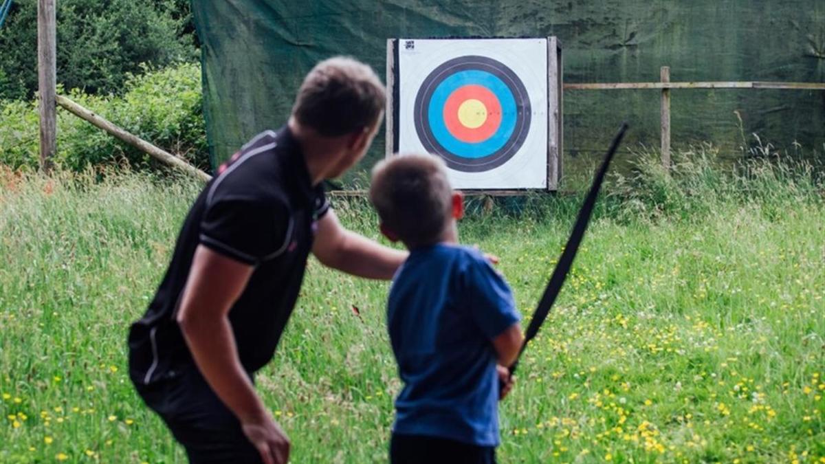 Visitors having a go at archery at The Jungle NI