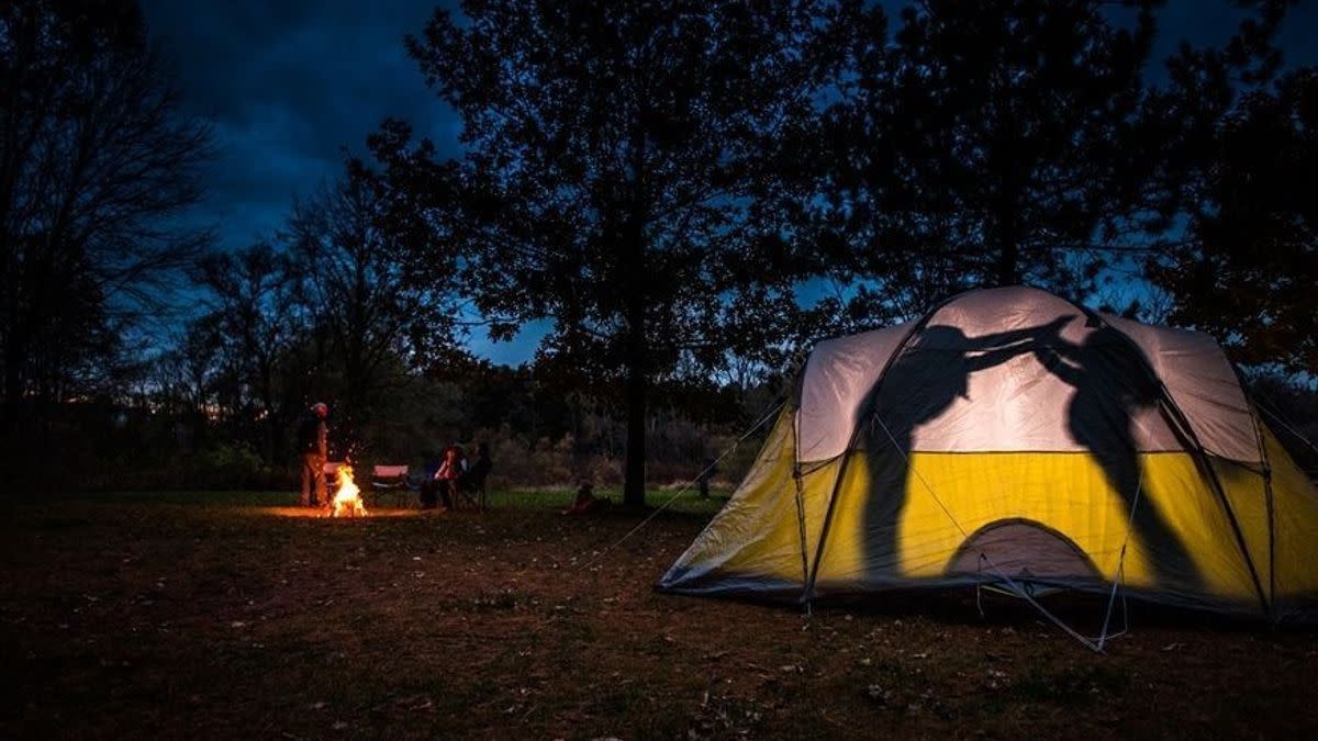People inside a camping tent