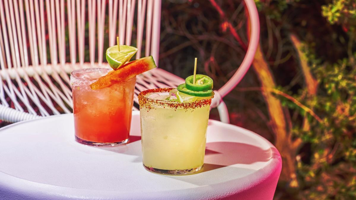 Two margarita from El Jefe at Saguaro in Palm Springs sit on a small table.