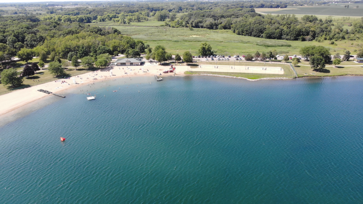 Aerial View of Lake Andrea with People on Beach