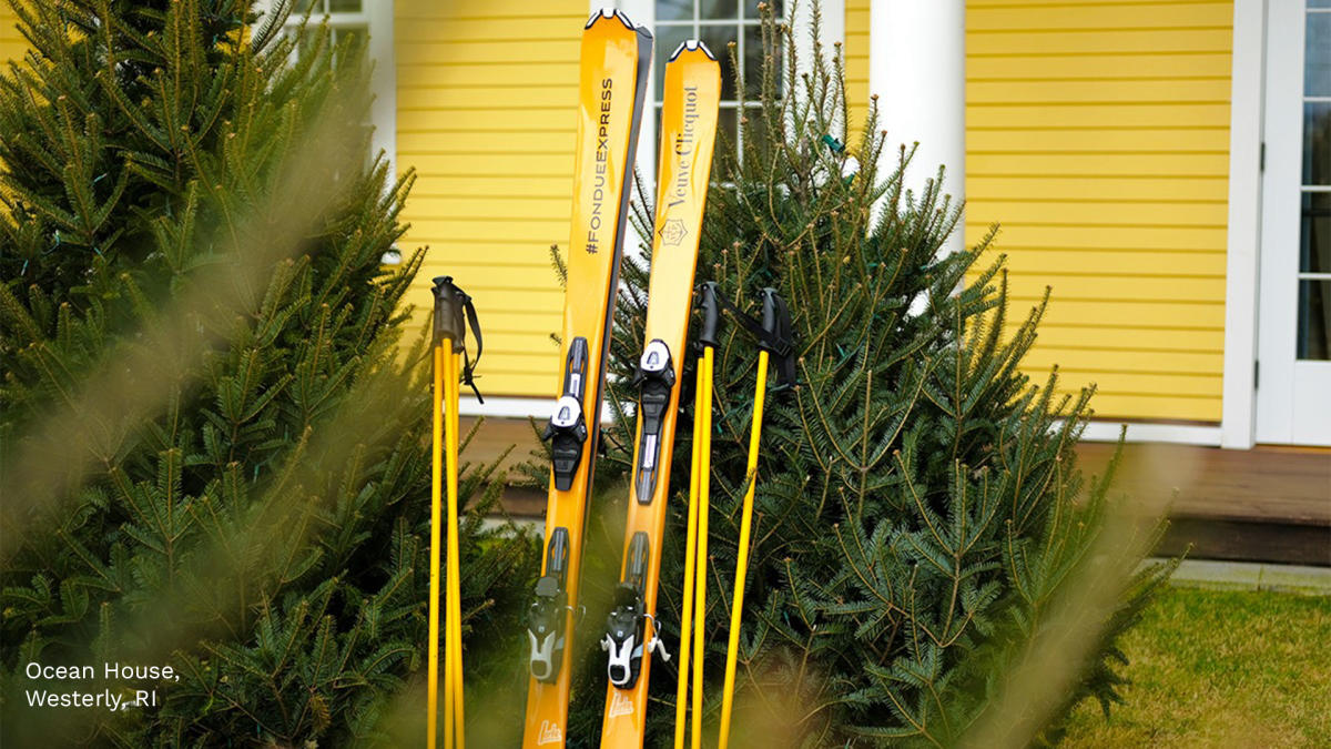 Exterior of Ocean House with skis and evergreens
