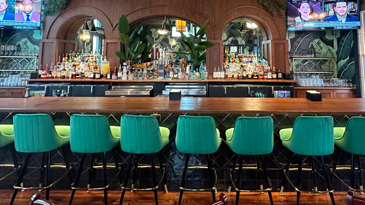 Bar top with green chairs