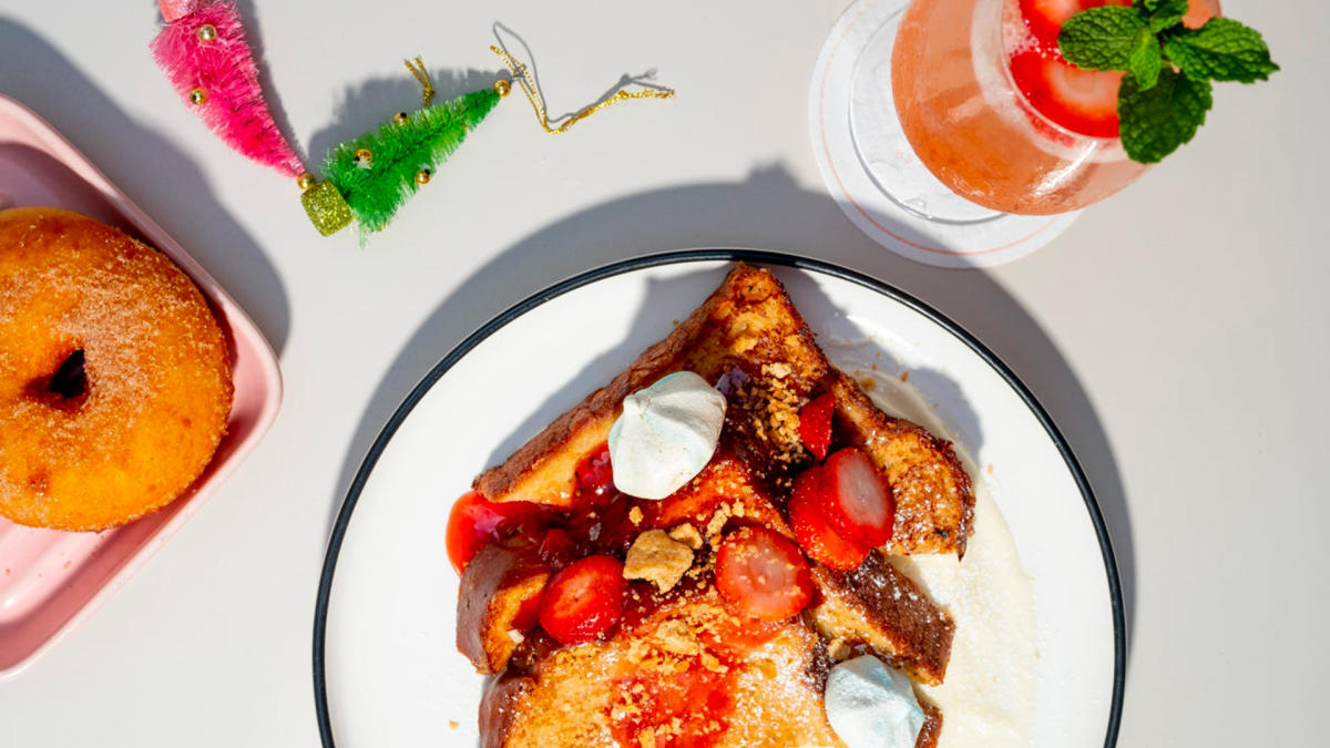 Overhead view of french toast meal with donut