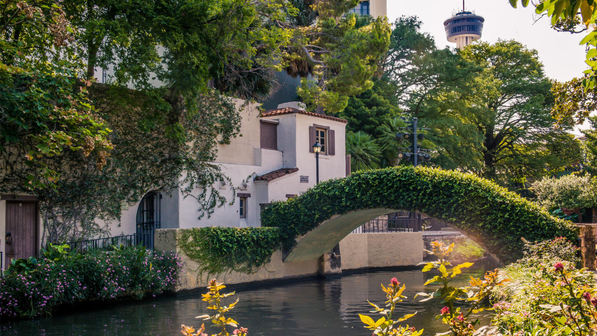 The River Walk bridge with Tower of the Americas in background