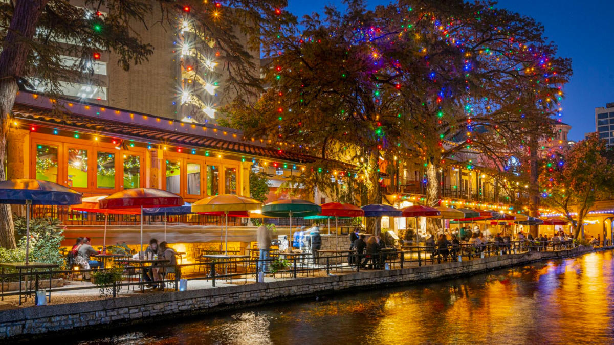 River Walk view with holiday lights adorned on trees