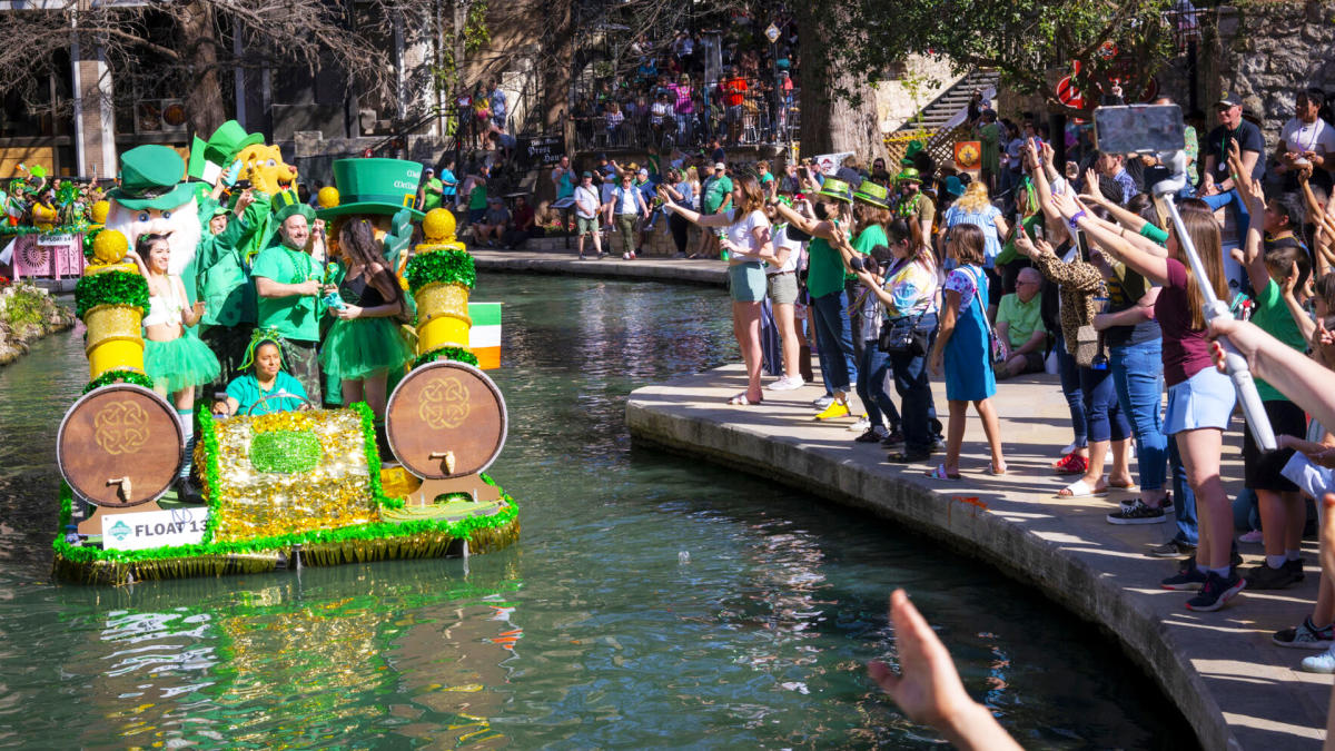 River barge decorated for St. Patrick's Day floating by Arneson River Theatre